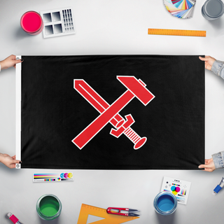 A mockup of the custom flag 'Schwarze Front flag' held up on a table during print checking