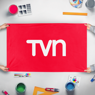 A mockup of the custom flag 'TVN flag' held up on a table during print checking