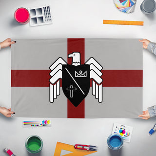 A mockup of the custom flag 'Basil England White flag' held up on a table during print checking