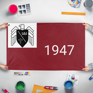 A mockup of the custom flag 'Basil 1947 flag' held up on a table during print checking