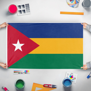 A mockup of the custom flag 'Rukhansas flag' held up on a table during print checking