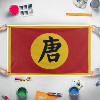 A mockup of the custom flag 'Tang Dynasty  flag' held up on a table during print checking
