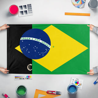 A mockup of the custom flag 'T flag' held up on a table during print checking