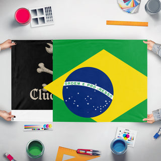 A mockup of the custom flag 'T flag' held up on a table during print checking