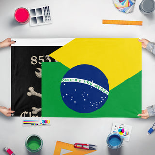 A mockup of the custom flag 'T flag' held up on a table during print checking