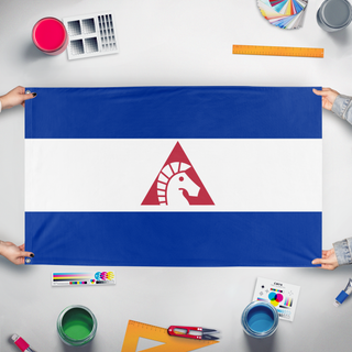 A mockup of the custom flag 'Tricoslavia flag' held up on a table during print checking