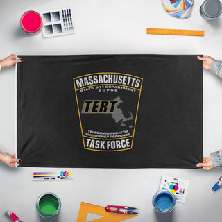 A mockup of the custom flag 'MA_TERT flag' held up on a table during print checking
