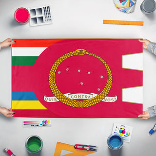 A mockup of the custom flag 'Carnaro flag' held up on a table during print checking