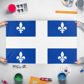 A mockup of the custom flag 'quebec flag' held up on a table during print checking