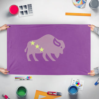 A mockup of the custom flag 'The Bison flag' held up on a table during print checking