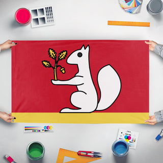 A mockup of the custom flag 'Tullin's personal flag' held up on a table during print checking