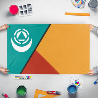 A mockup of the custom flag 'Qinal flag' held up on a table during print checking