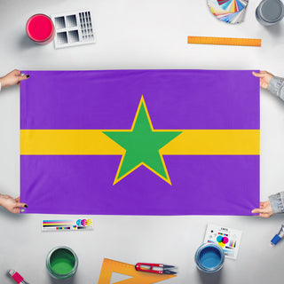 A mockup of the custom flag 'anq flag' held up on a table during print checking