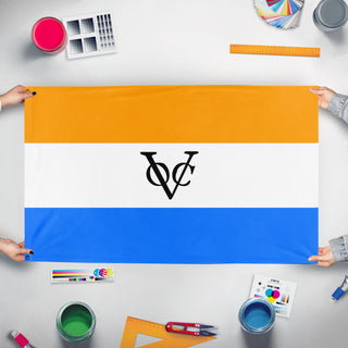 A mockup of the custom flag 'Orange VOC flag' held up on a table during print checking