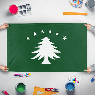 A mockup of the custom flag 'New England Green Tree flag' held up on a table during print checking