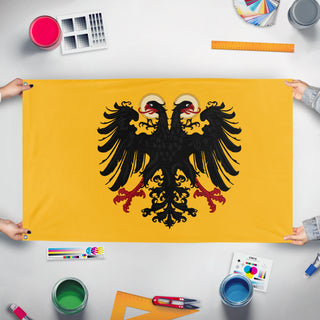 A mockup of the custom flag 'Holy Roman Empire flag' held up on a table during print checking