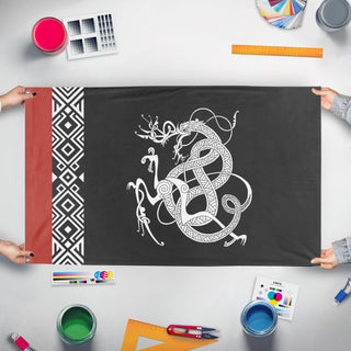 A mockup of the custom flag 'Stilt flag' held up on a table during print checking