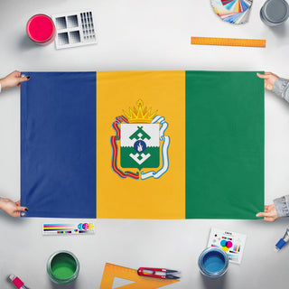 A mockup of the custom flag 'L'bania flag' held up on a table during print checking