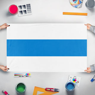 A mockup of the custom flag 'White-Azure-White Russia flag' held up on a table during print checking