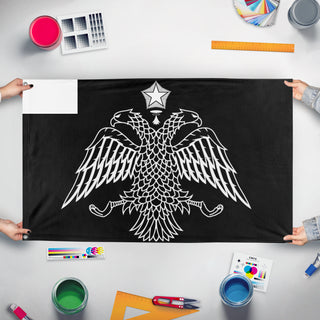A mockup of the custom flag 'Grey Bird flag' held up on a table during print checking