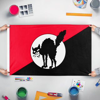 A mockup of the custom flag 'Sabotabby 2.0 flag' held up on a table during print checking
