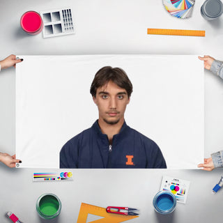 A mockup of the custom flag 'HASAN flag' held up on a table during print checking