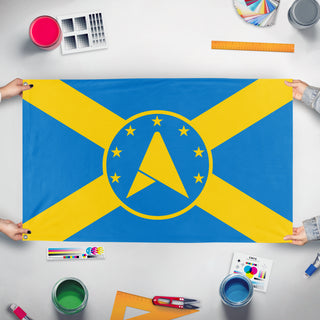 A mockup of the custom flag 'Council of Andrews flag' held up on a table during print checking