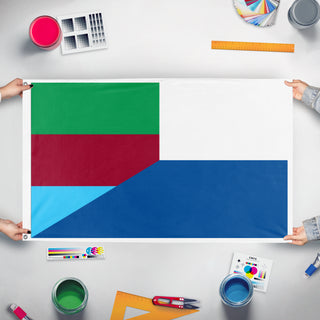 A mockup of the custom flag 'nova tuguria flag' held up on a table during print checking