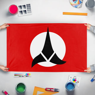 A mockup of the custom flag 'Klingon Empire flag' held up on a table during print checking
