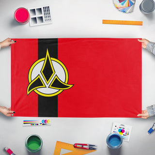 A mockup of the custom flag 'Klingon Empire flag' held up on a table during print checking