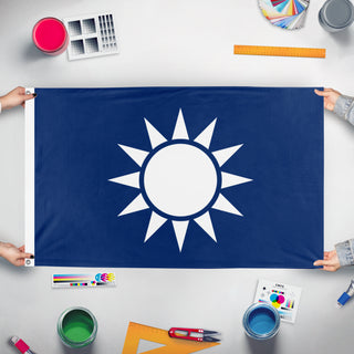 A mockup of the custom flag 'Kuomintang Party' held up on a table during print checking