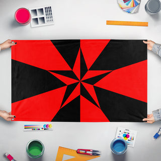A mockup of the custom flag 'Libertarian Socialist flag' held up on a table during print checking