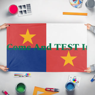 A mockup of the custom flag 'T flag' held up on a table during print checking