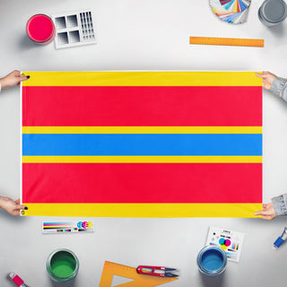 A mockup of the custom flag 'Indochinese Union flag' held up on a table during print checking
