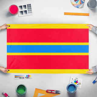 A mockup of the custom flag 'Indochina flag' held up on a table during print checking