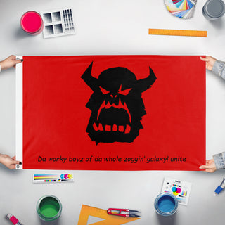 A mockup of the custom flag 'ork marxist  flag' held up on a table during print checking