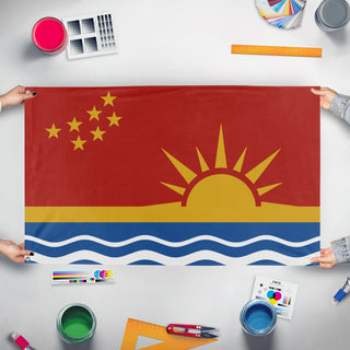A mockup of the custom flag 'Columbya Peoples Liberation Union flag' held up on a table during print checking