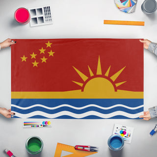 A mockup of the custom flag 'Columbya Peoples Liberation Union flag' held up on a table during print checking