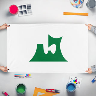 A mockup of the custom flag 'Aomori flag' held up on a table during print checking