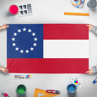 A mockup of the custom flag 'Stars and Bars flag' held up on a table during print checking