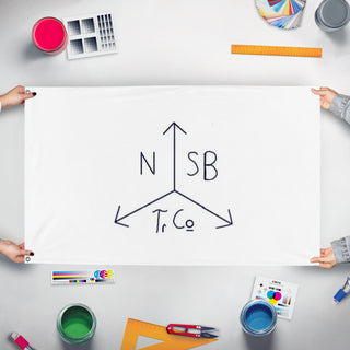 A mockup of the custom flag 'Northern Stormbridge trading company  flag' held up on a table during print checking