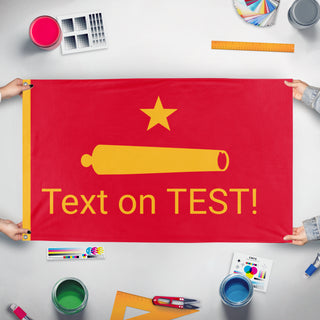 A mockup of the custom flag 'T flag' held up on a table during print checking