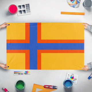 A mockup of the custom flag 'Ingria flag' held up on a table during print checking