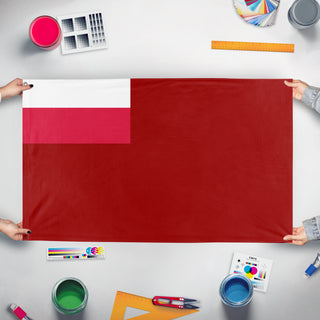 A mockup of the custom flag 'Polish SSR flag' held up on a table during print checking