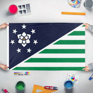 A mockup of the custom flag 'Federation of the Creekside Republics flag' held up on a table during print checking