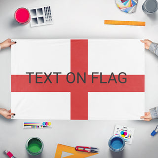 A mockup of the custom flag 'test 2 flag' held up on a table during print checking
