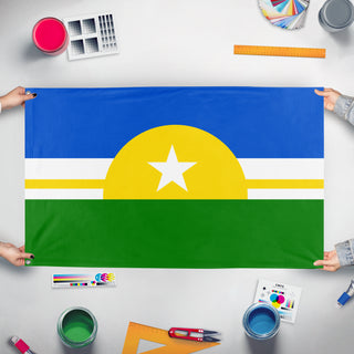 A mockup of the custom flag 'Superior' held up on a table during print checking