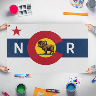 A mockup of the custom flag 'Fallout Colorado NCR flag' held up on a table during print checking