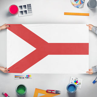 A mockup of the custom flag 'test10 flag' held up on a table during print checking