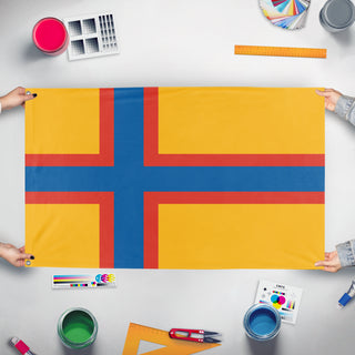 A mockup of the custom flag 'Ingria Flag' held up on a table during print checking